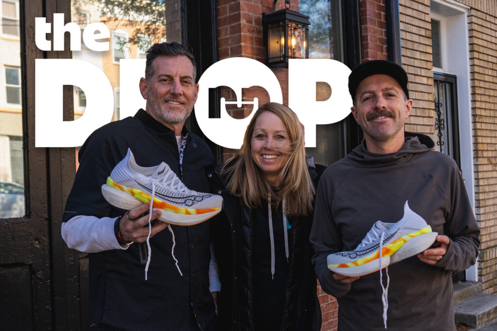 the drop e317 man holding a saucony running shoe