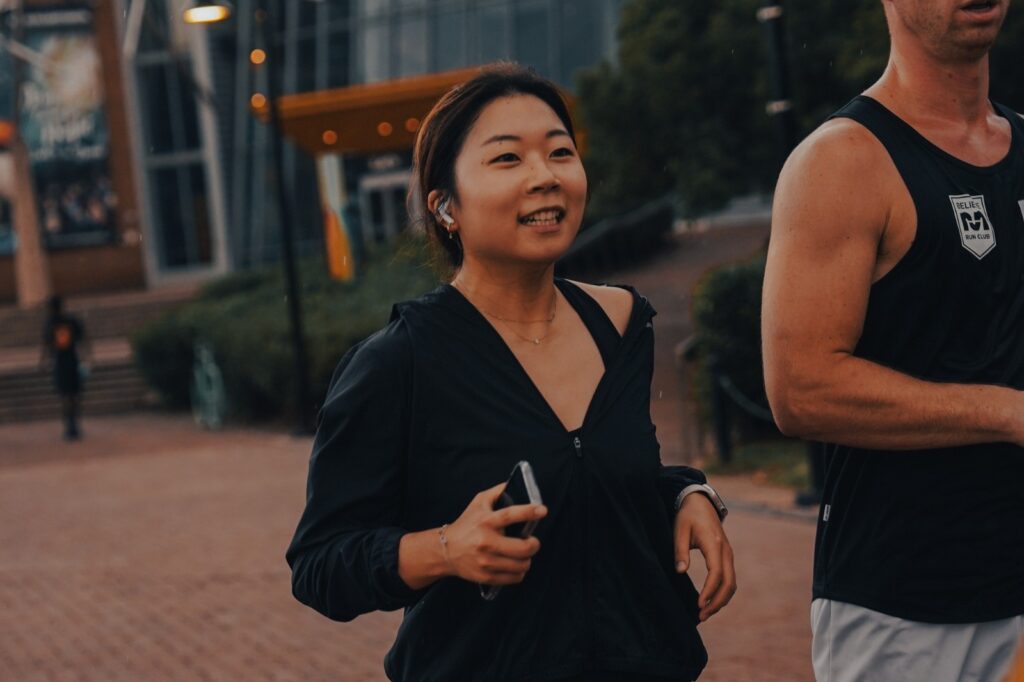 girl running with earbuds